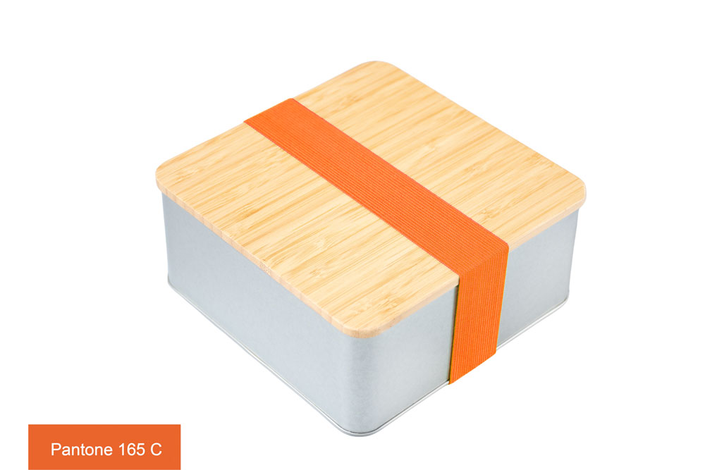 Closed square tin box with bamboo lid and orange ribbon (Pantone 165 C), photographed on a white background.