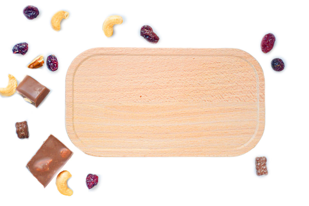 Beech lid on a white background, surrounded by nuts and dried fruit – high-quality replacement lid for lunch boxes