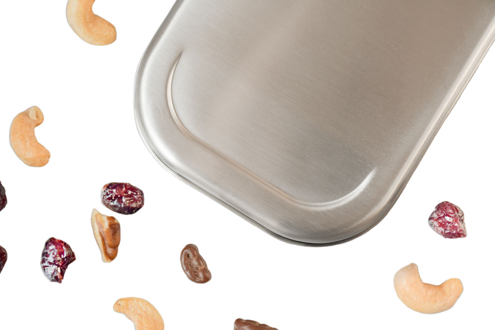 Close-up view of stainless steel lid with nuts and dried fruit – sustainable replacement lid for stainless steel lunch box