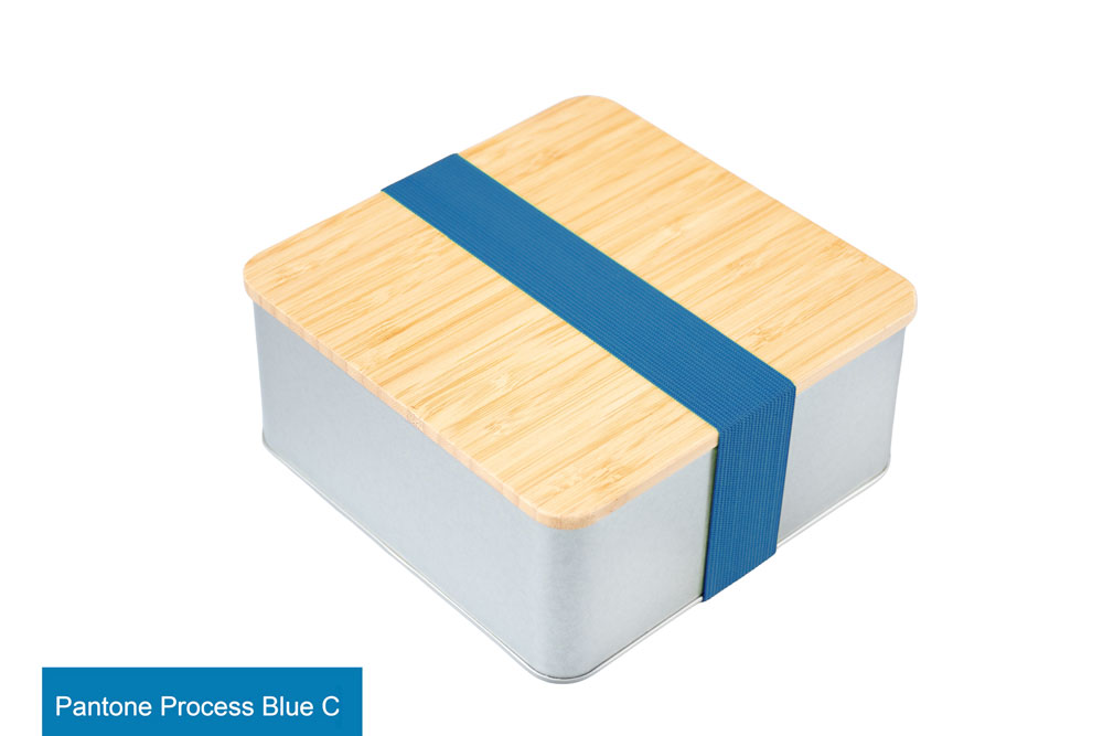 Closed square tin with bamboo lid and blue ribbon (Pantone Process Blue C), photographed on a white background.