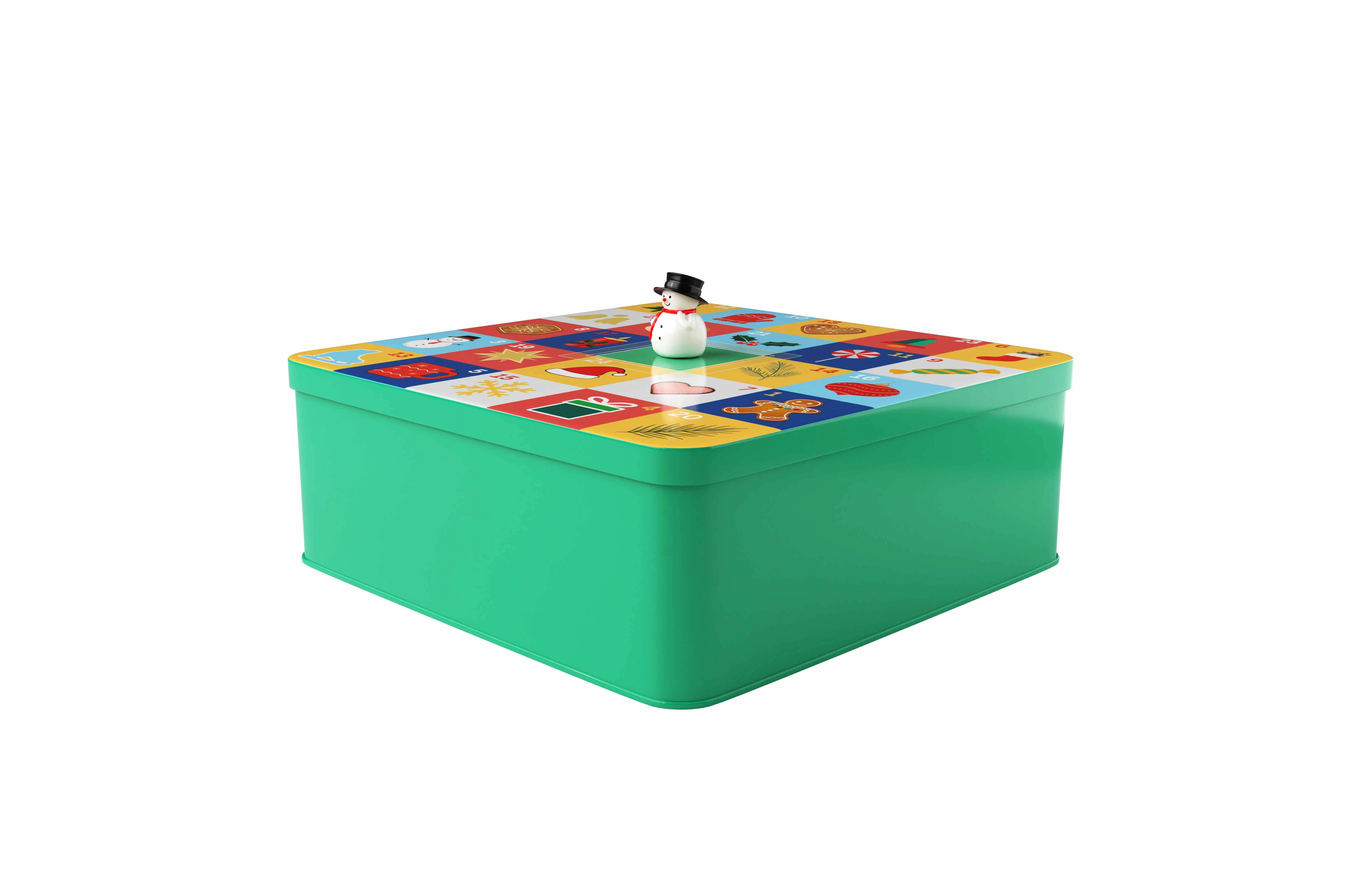 Quadratische Weihnachtsdose aus Weißblech mit winterlichem Motiv und aufgedrucktem Kalender mit magnetischem Datumsschieber